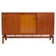 Modern mid-century teak sideboard with brass details.