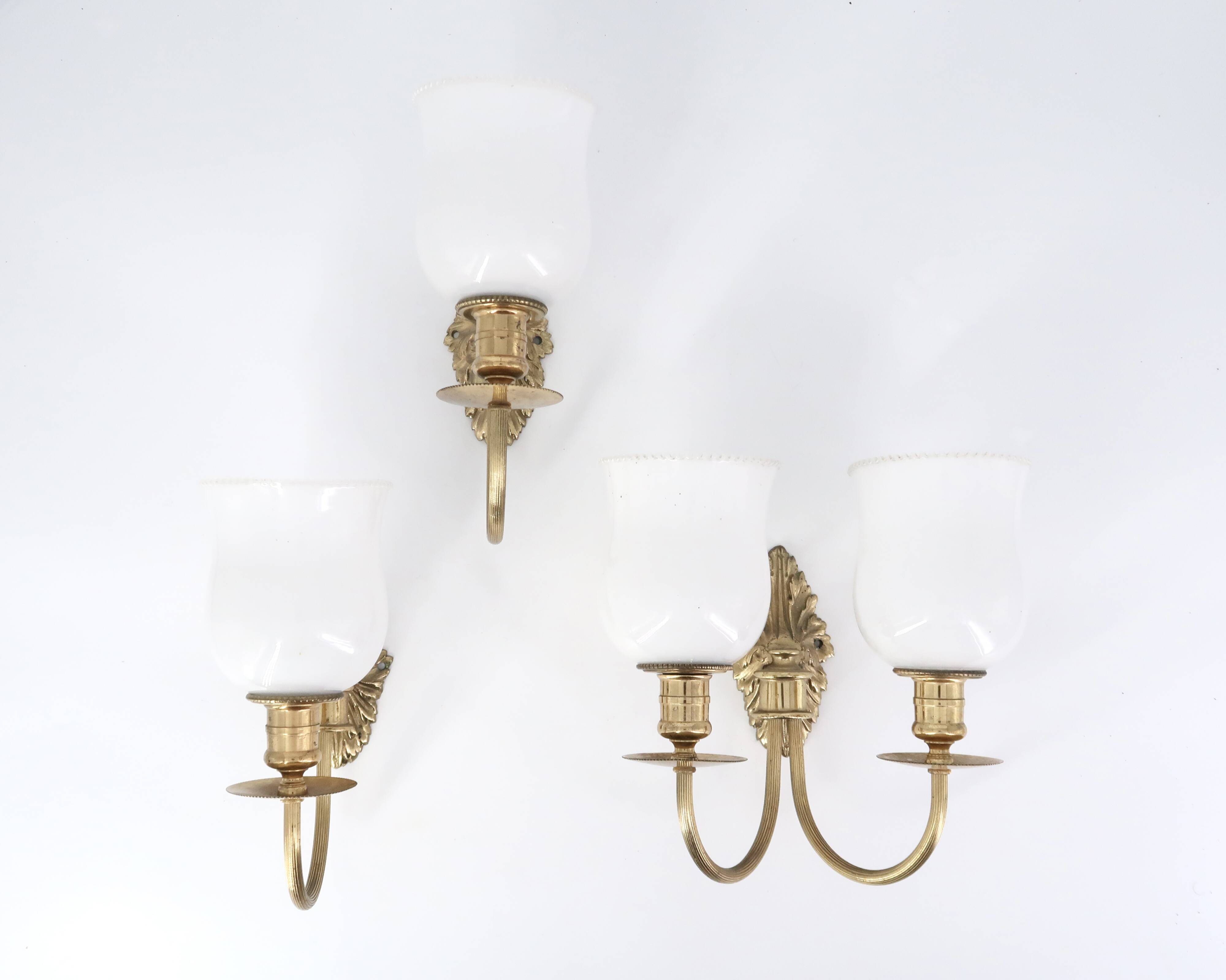 Three wall lights in brass and opaque glass, 1950s