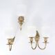 Three brass and opaque glass wall lights, 1950s.