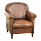 Comfortable characterful sheepskin armchair finished with decorative nails