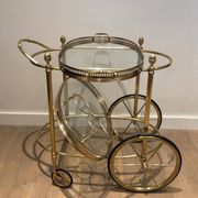 Oval brass trolley from Maison Baguès.