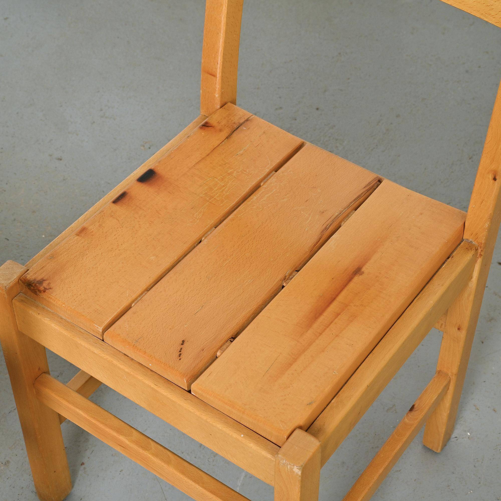 Set of six solid pine chairs by Maison Regain.