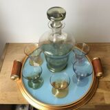 Aperitif liqueur service in iridescent glass on tray