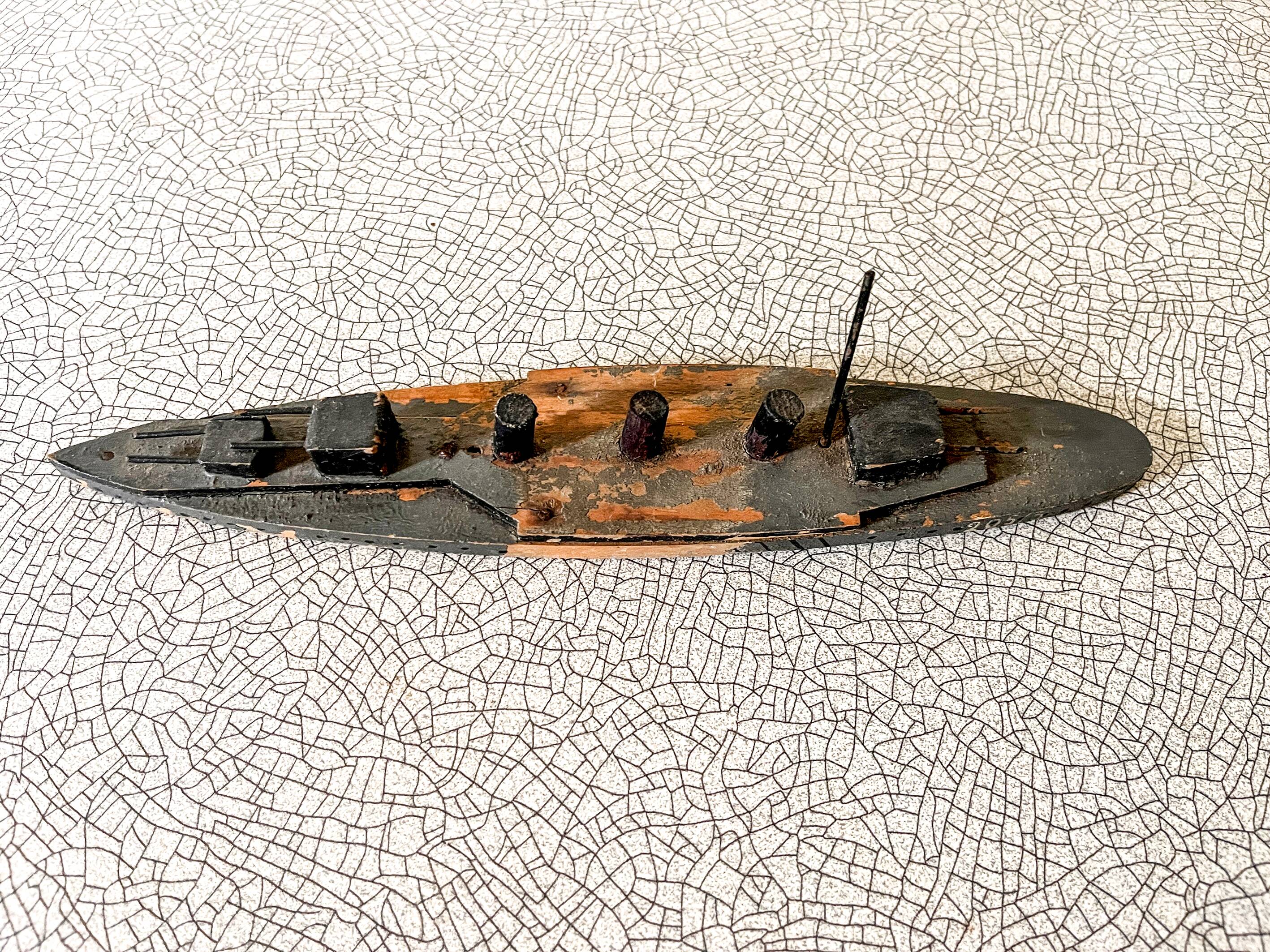 Wooden destroyer boat, antique toy from the early century.