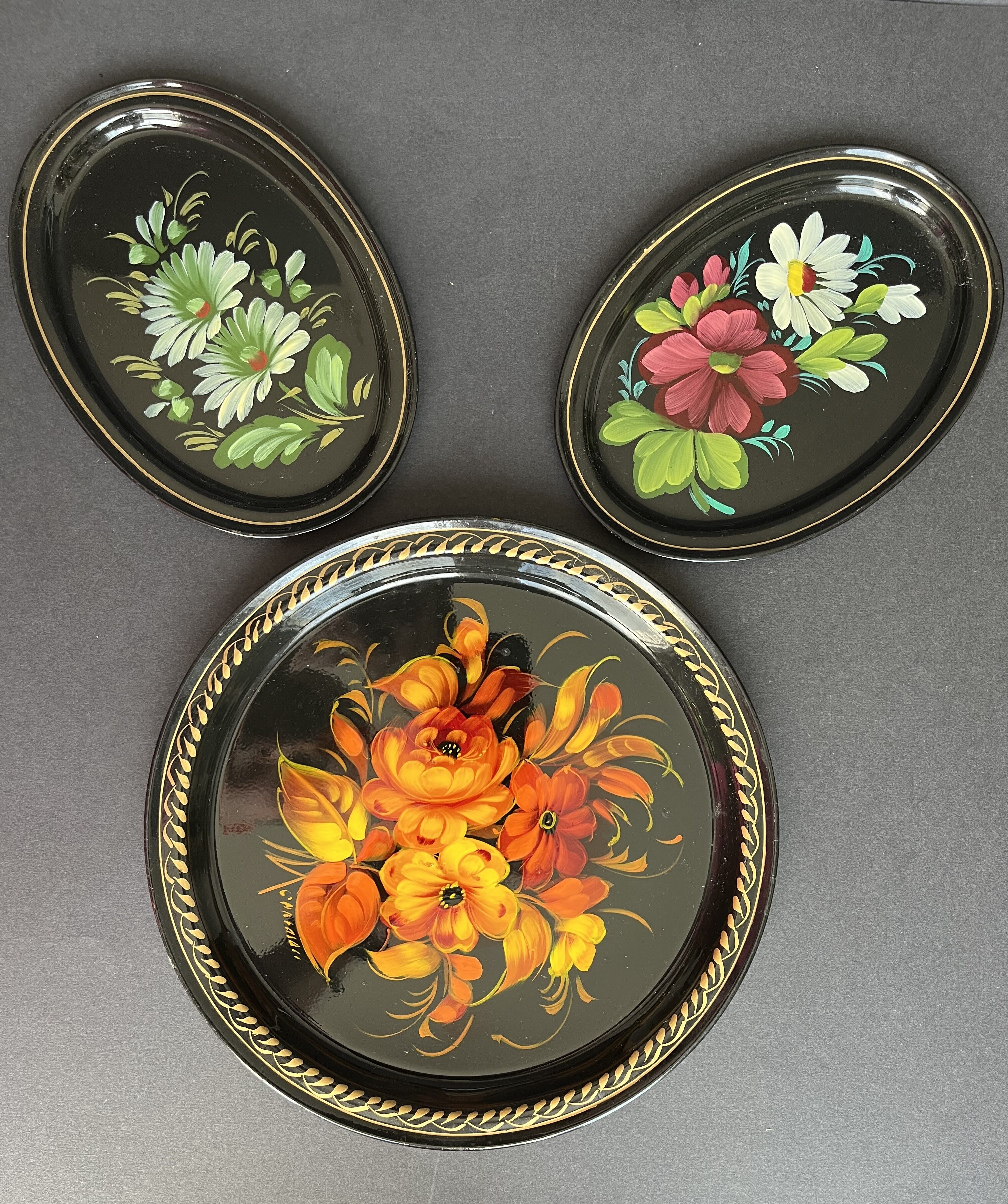 Set of three painted sheet metal trays