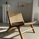 Reclining armchair in natural wood and woven rattan