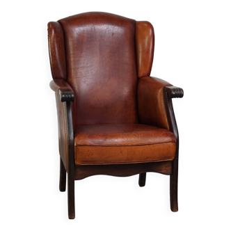 Classic vintage sheepskin wing chair with beautiful finish and warm colours