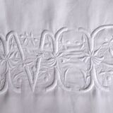 old pillowcase embroidered with fine flowers, marked MP, 19th