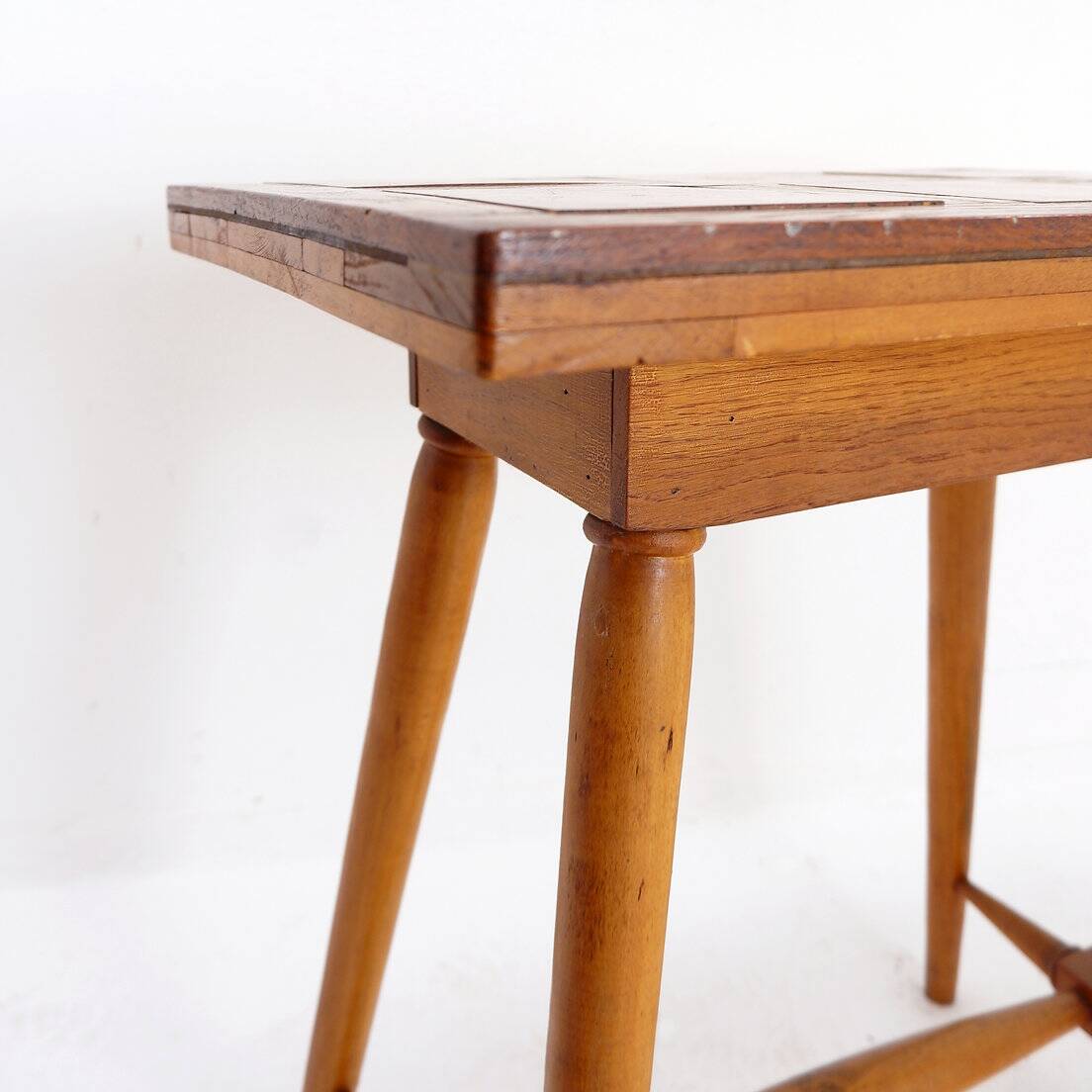 Vintage wooden side table with terracotta top