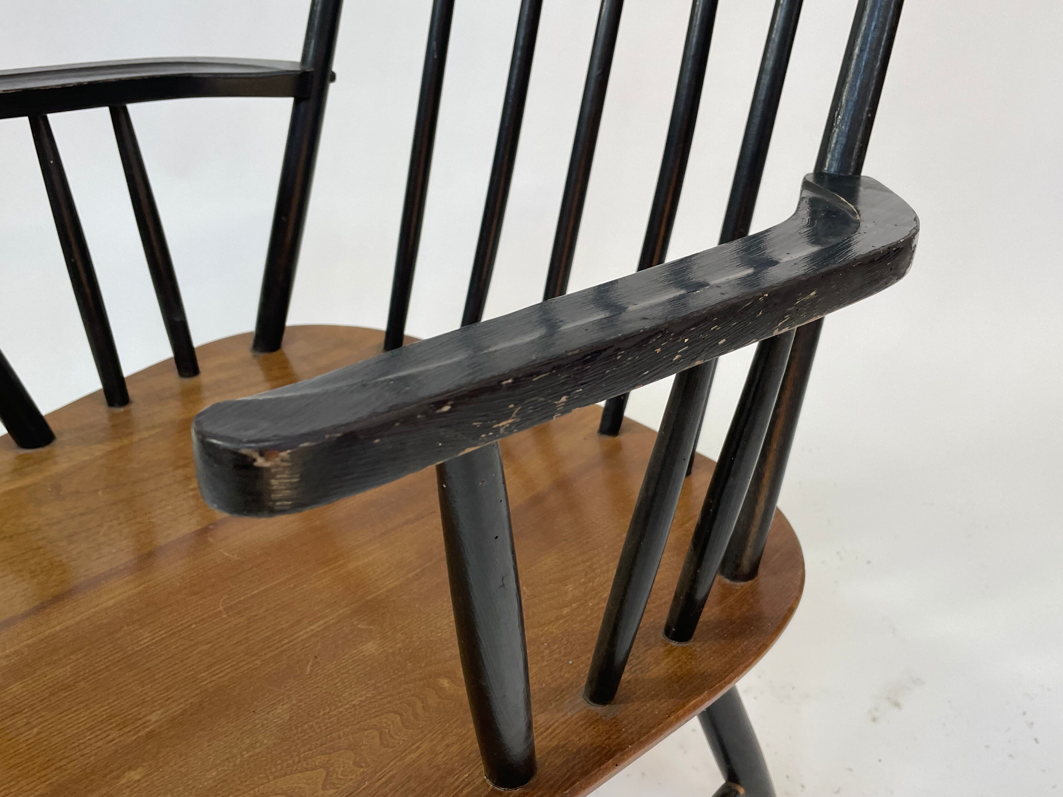 Vintage easy chair with high back and armrest from the 60s