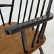 Vintage easy chair with high back and armrest from the 60s