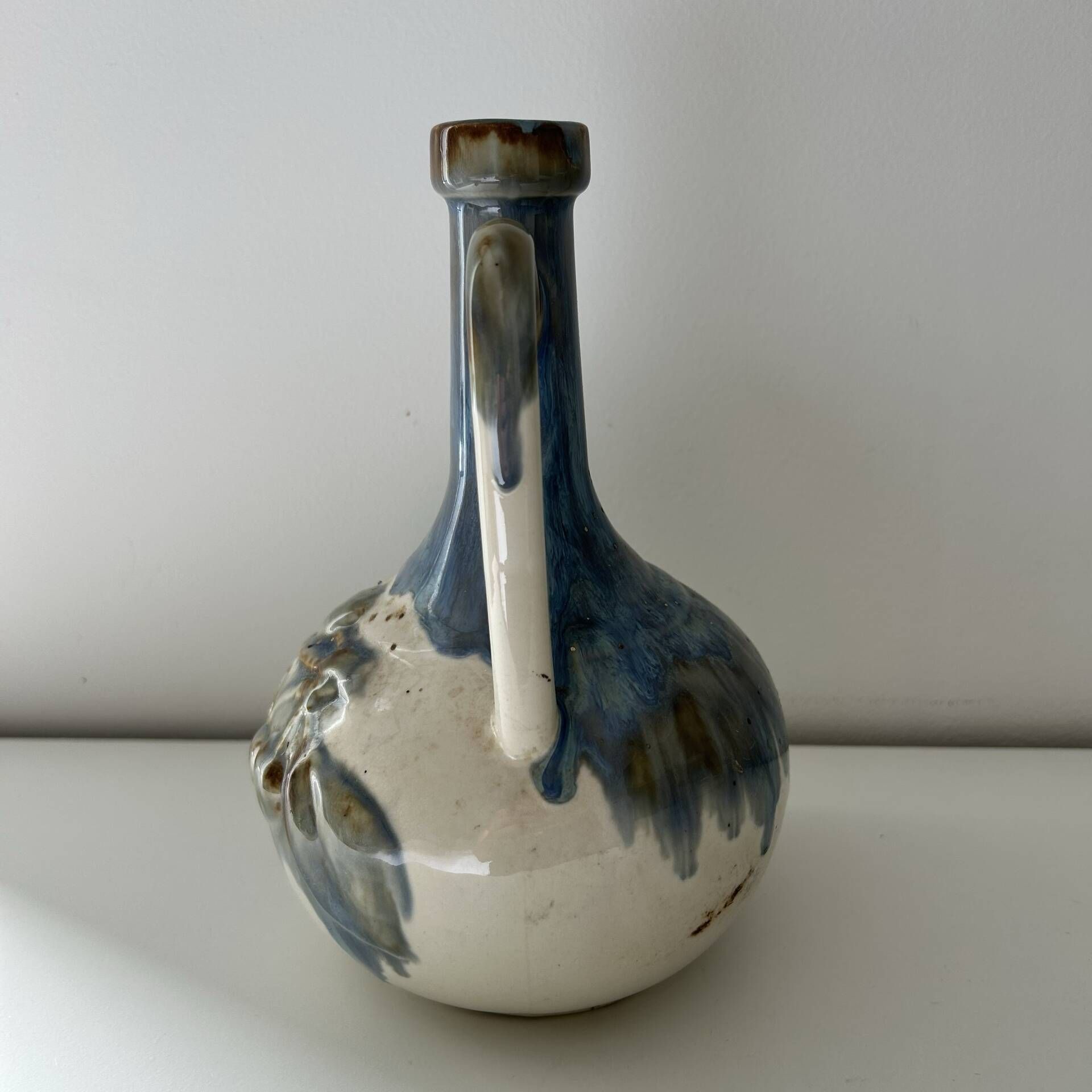 Cherry-decorated earthenware carafe