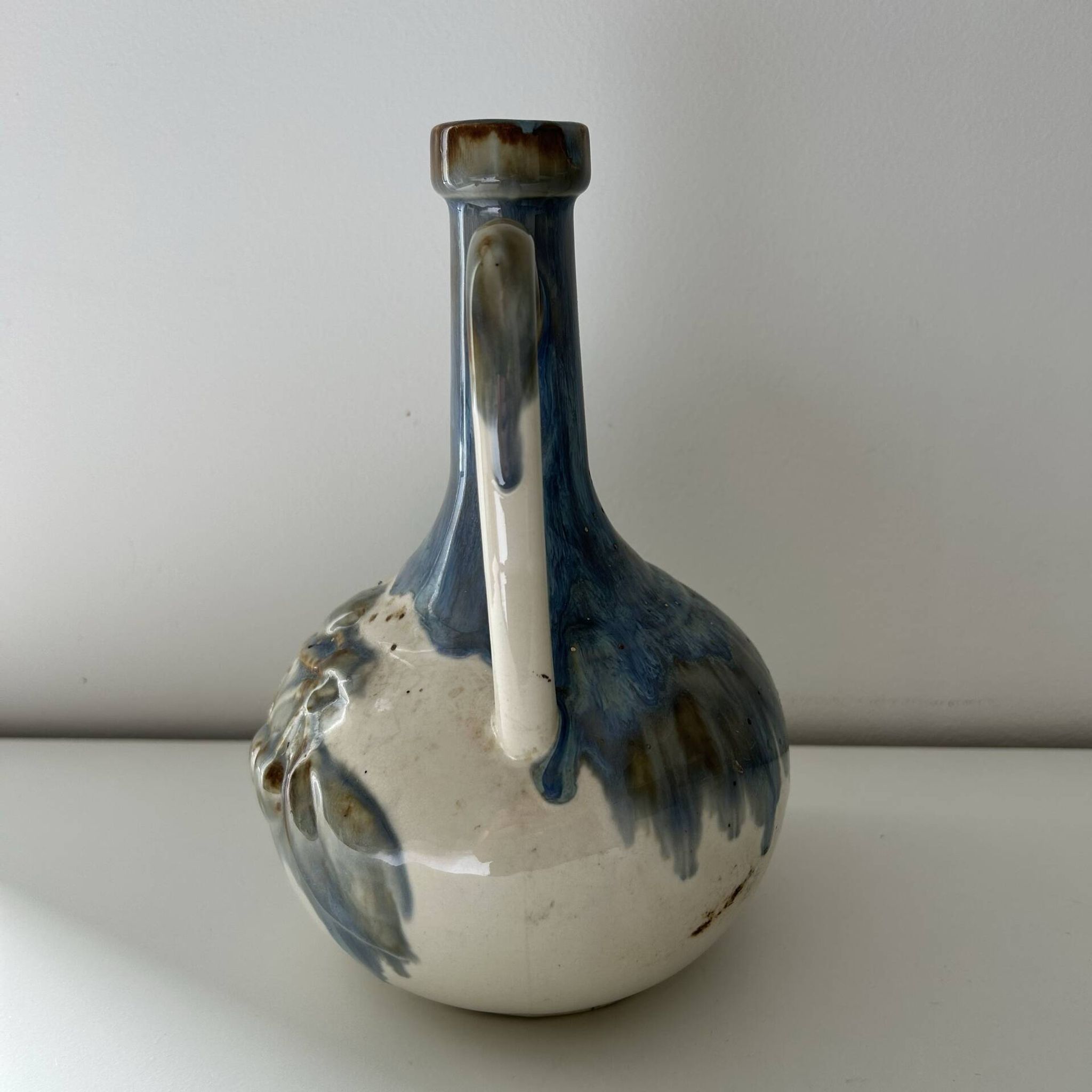 Cherry-decorated earthenware carafe
