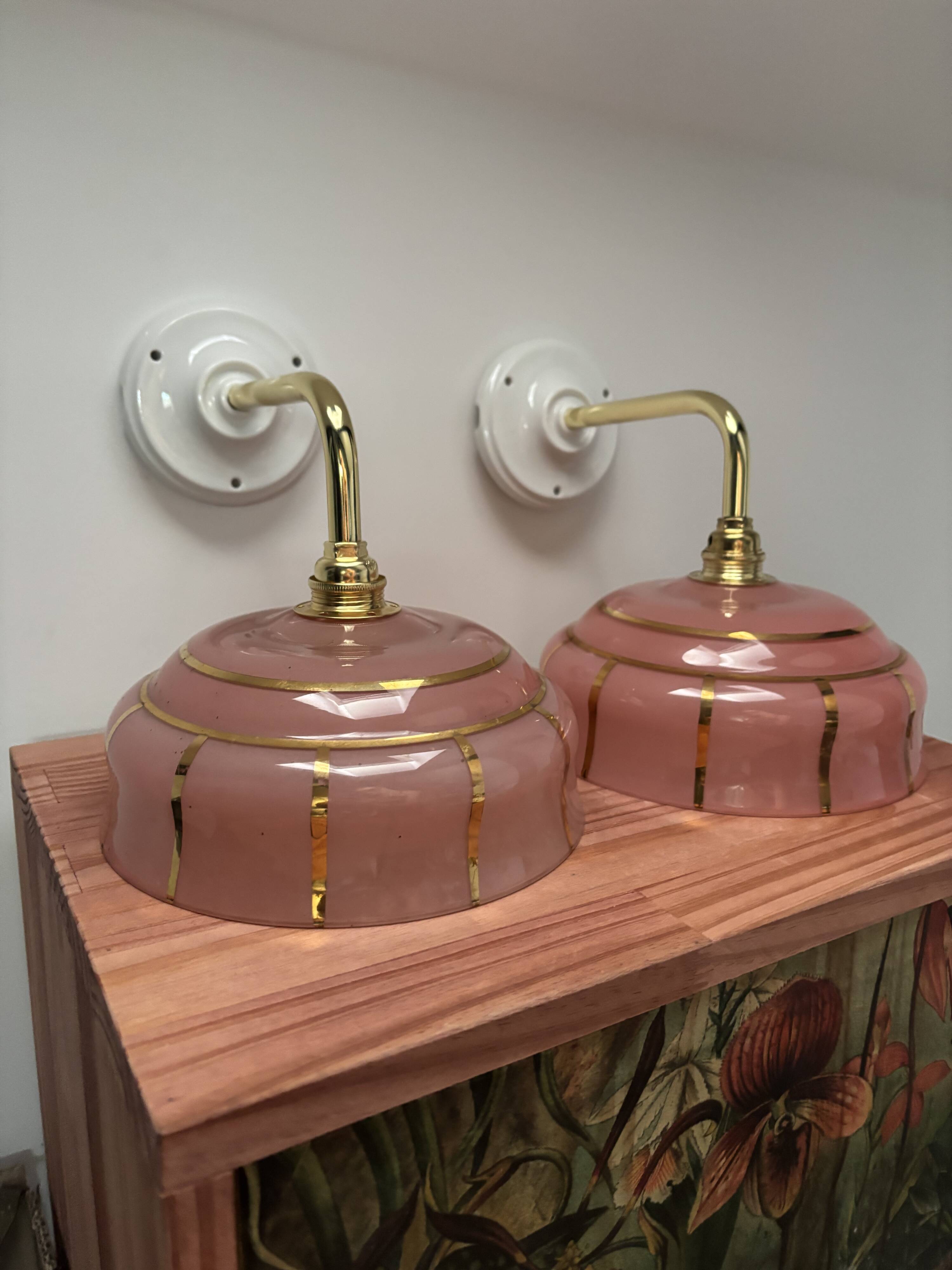 Pair of white ceramic wall lights with pink glass