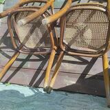 Set of 2 antique bistro chairs. Curved and turned wood.