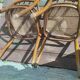 Set of 2 antique bistro chairs. Curved and turned wood.