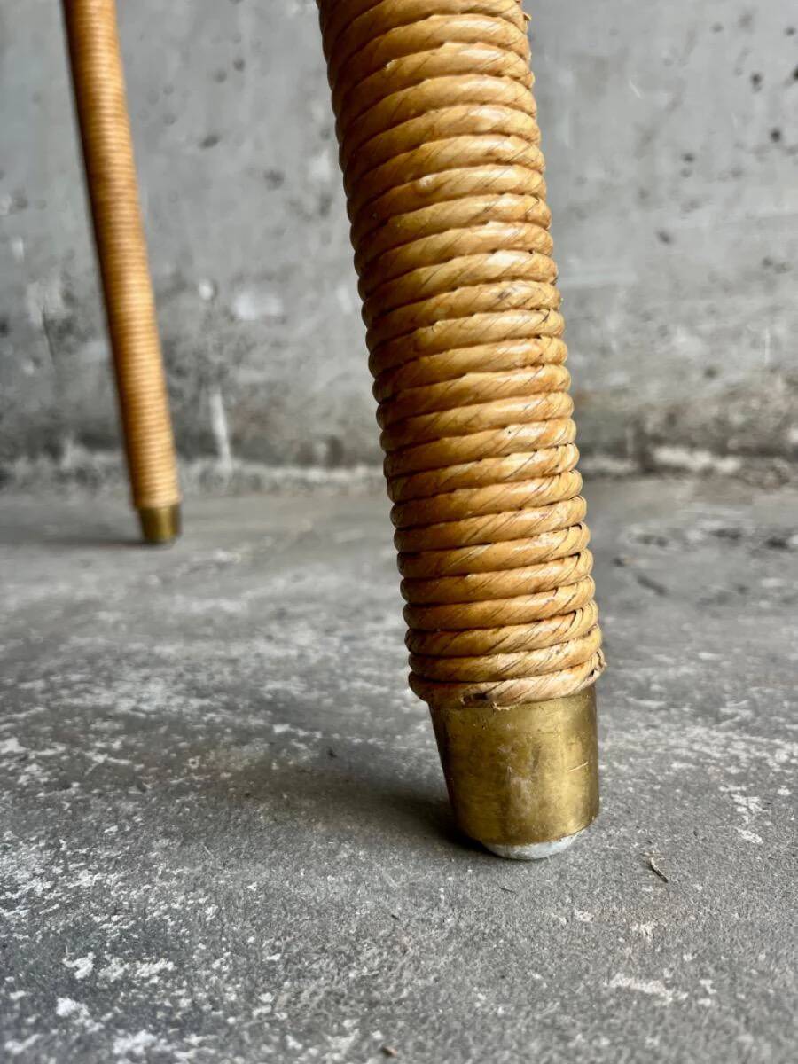 Natural Lloyd Loom paper cord rattan round table with brass-capped legs by Vincent Sheppard
