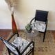 Black wooden armchair with golden leaves