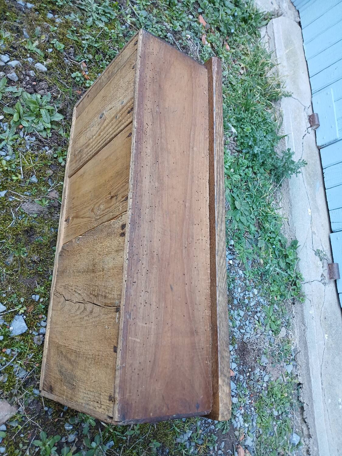 Small old wooden chest with hinged lid