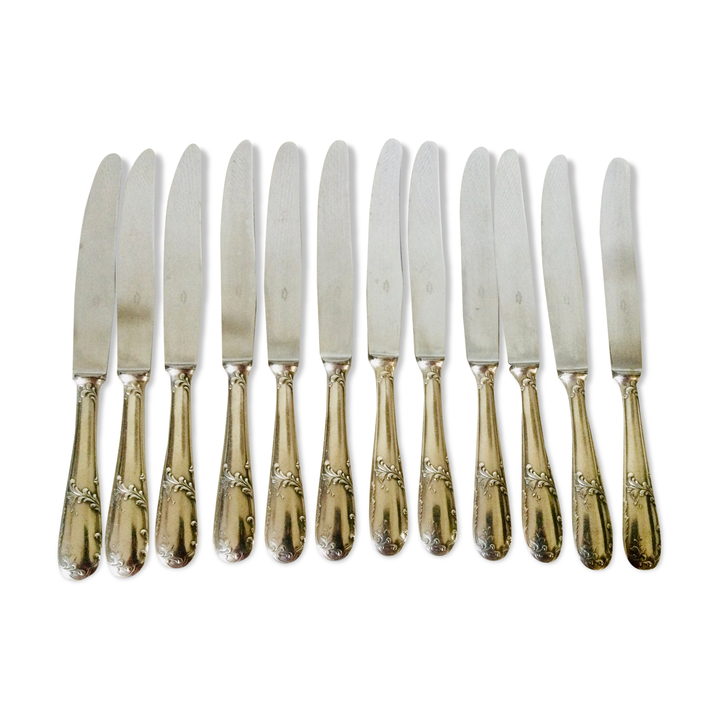 12 silver metal handle knives