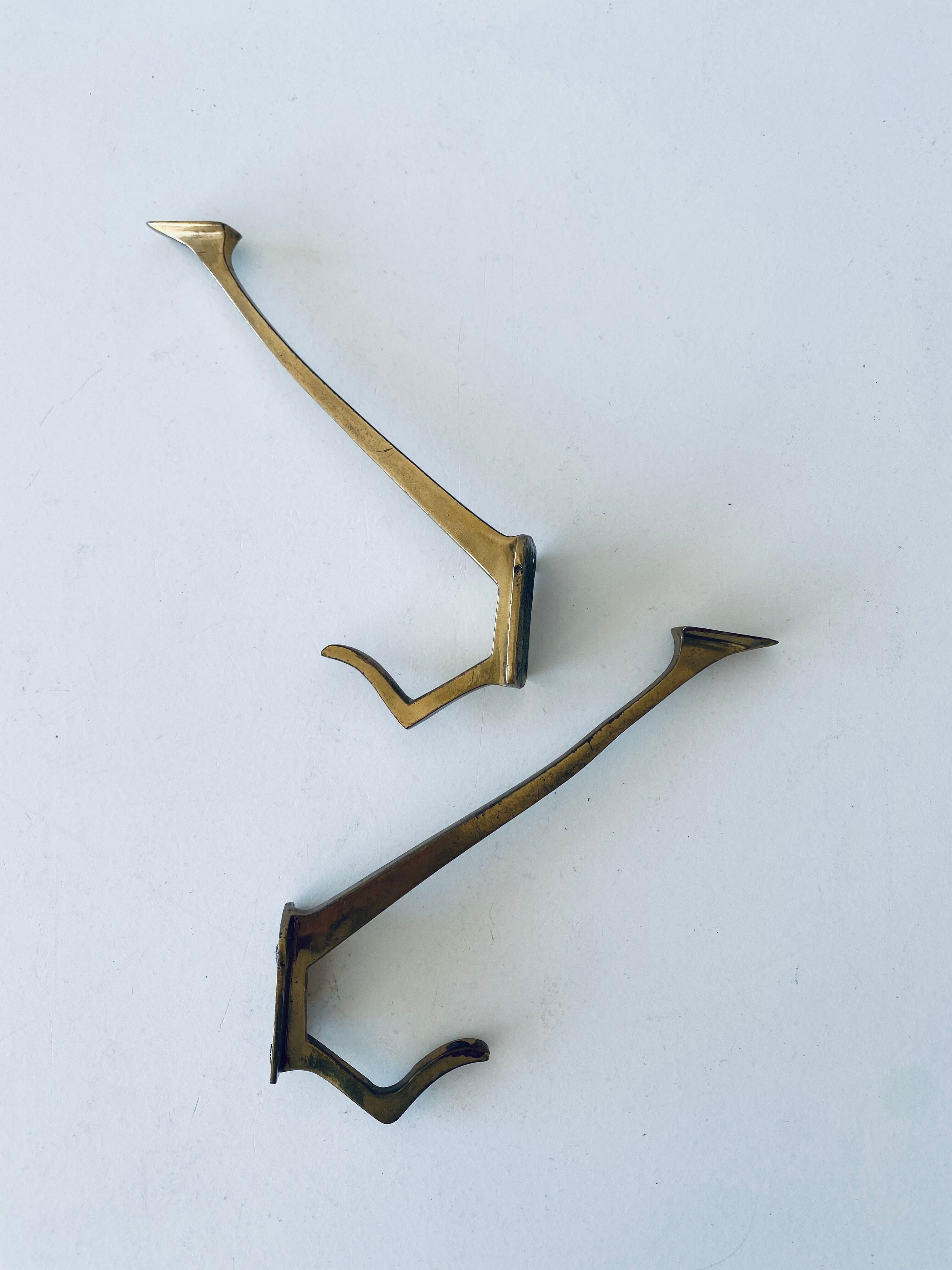 Pair of vintage brass hooks