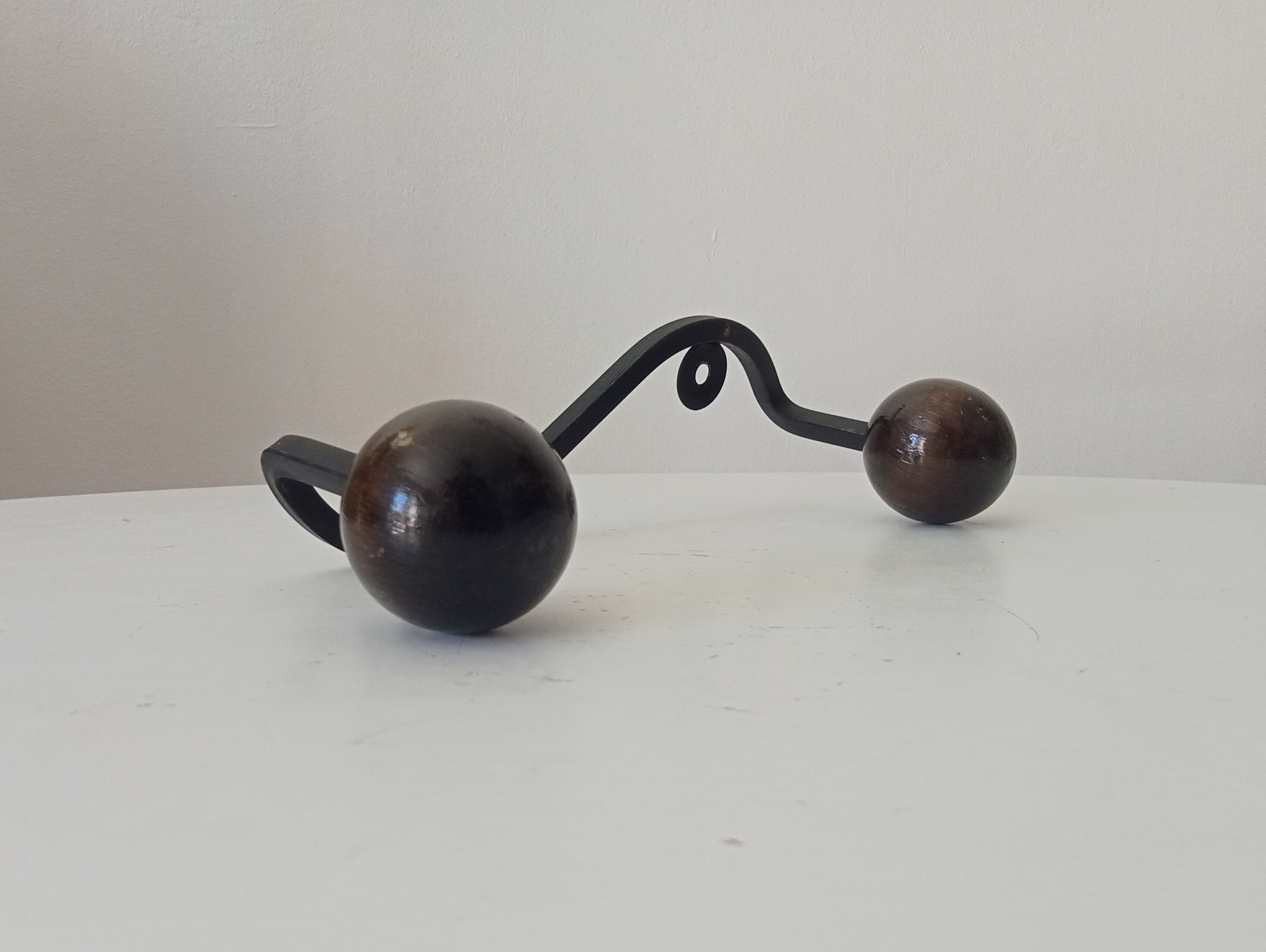 Wood and wrought iron ball coat rack from the 1950s.