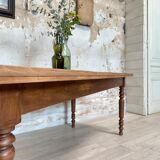 Vintage farmhouse table with turned legs.