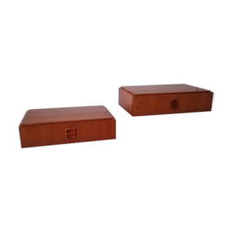 A pair of bedside tables