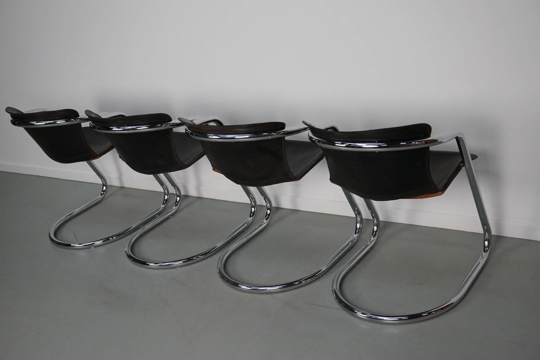 Set of four brown leather dining chairs, Willy Rizzo, 1970