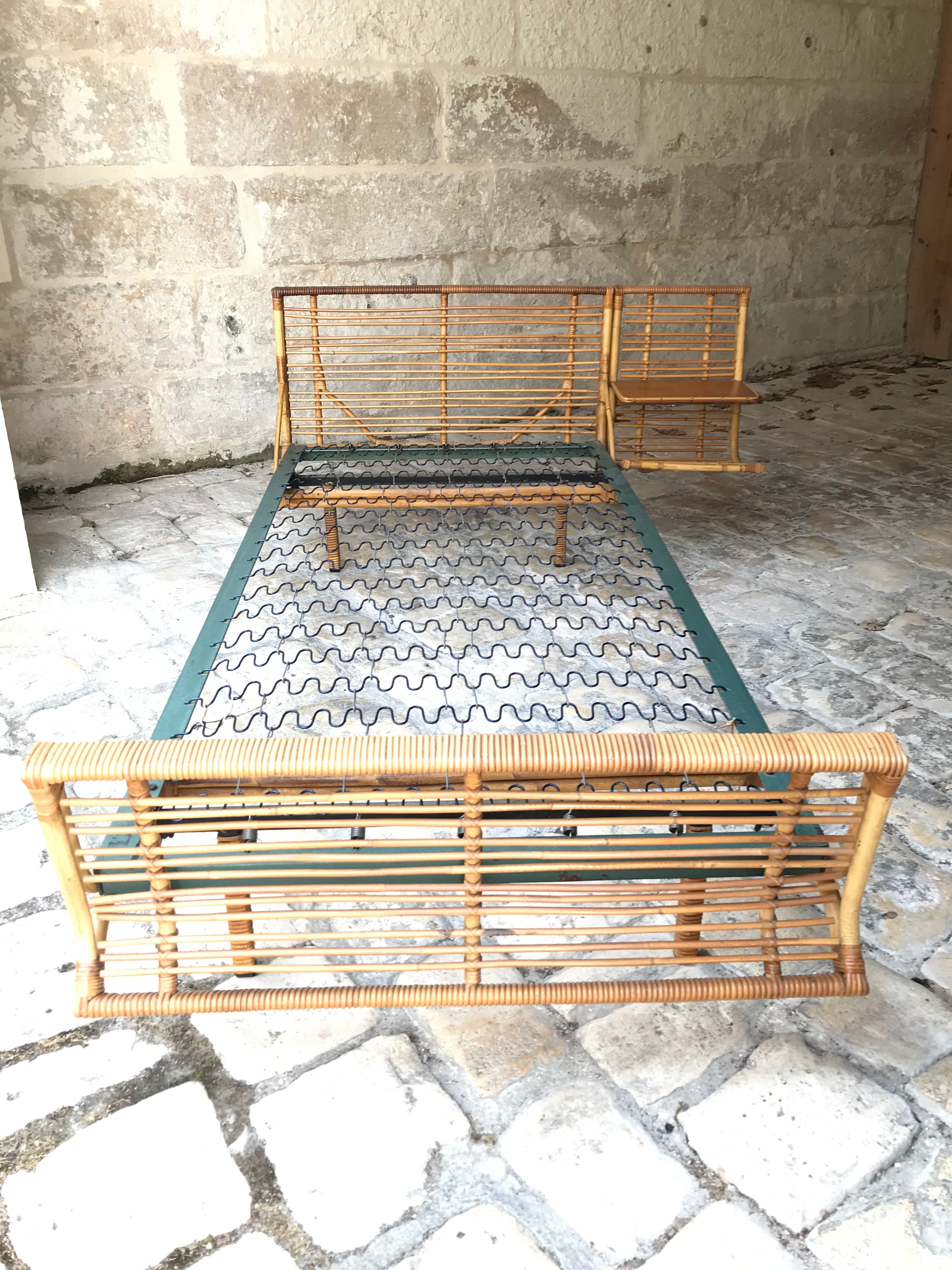 Twin rattan beds with built-in bedside tables
