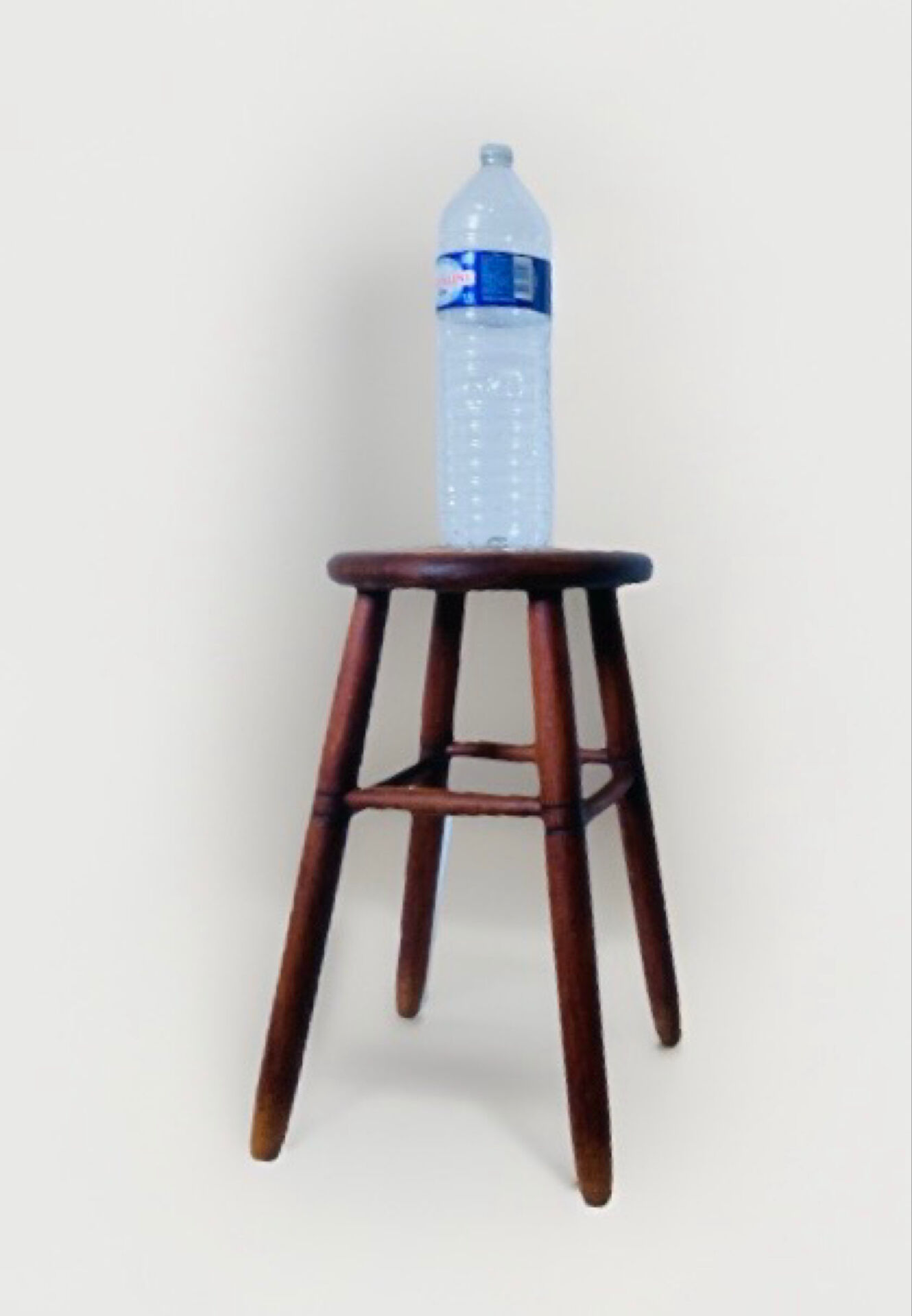 Vintage four-legged stool made of solid wood from the 1970s/80s.