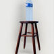 Vintage four-legged stool made of solid wood from the 1970s/80s.