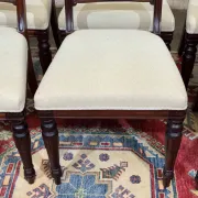Set of 2 armchairs and 6 English mahogany chairs from the 1950s.