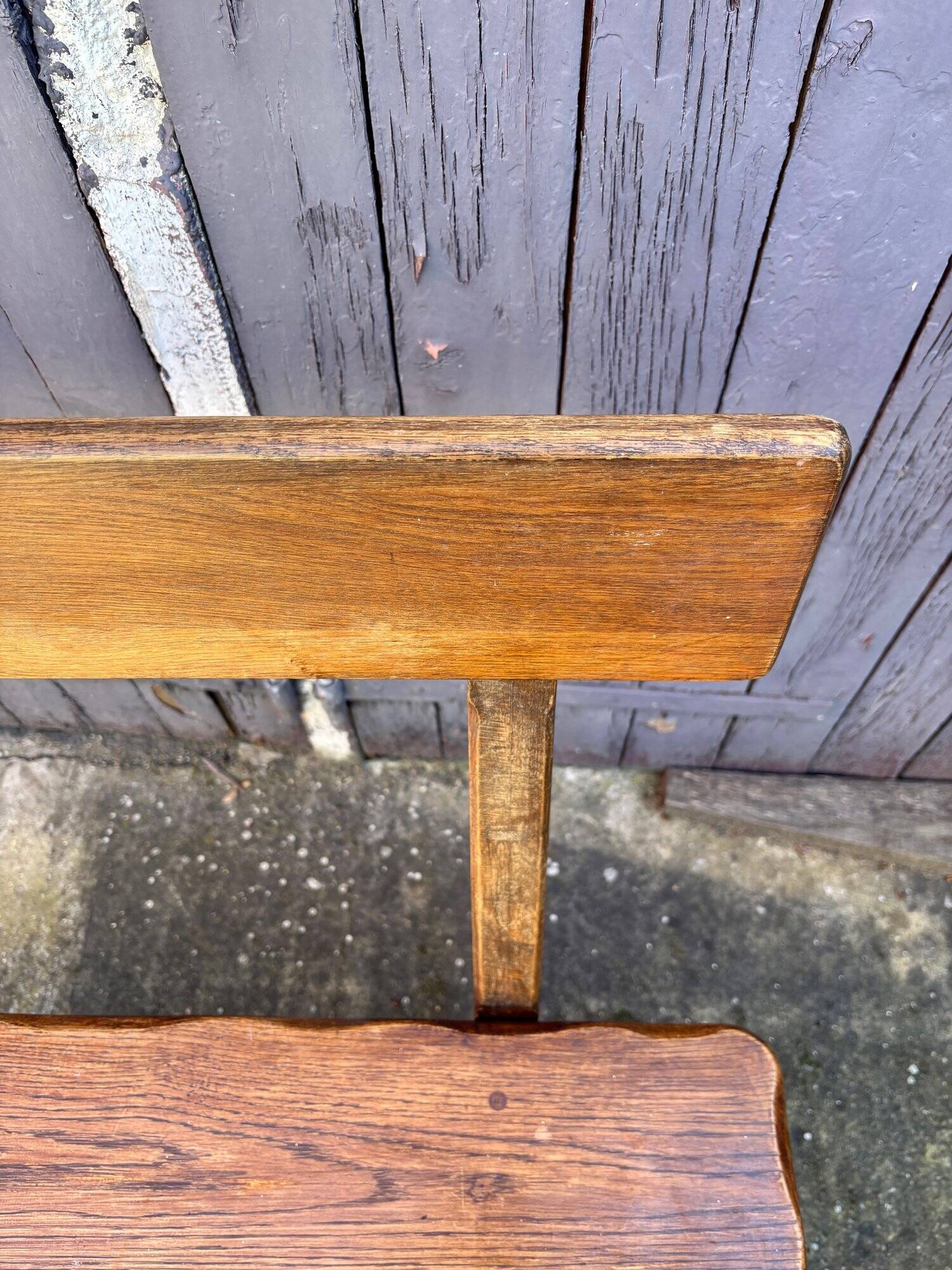 Brutalist bench with dark wood back