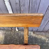 Brutalist bench with dark wood backrest