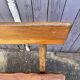 Brutalist bench with dark wood back