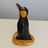 Small plaster penguin statue