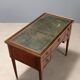 Neoclassical writing desk made of violet wood, 18th century.