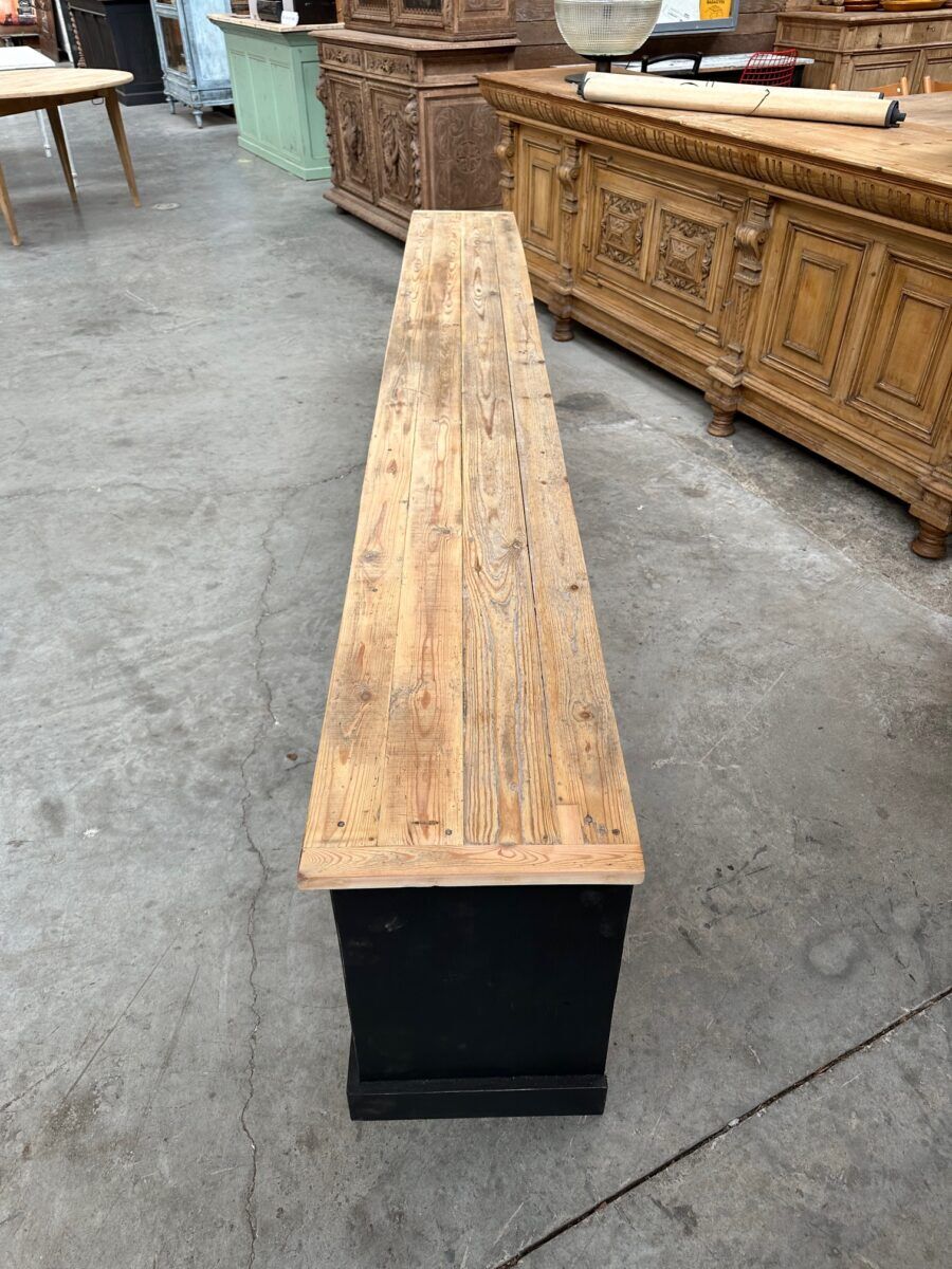 Old workshop furniture transformed into a TV unit.