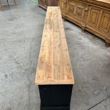 Old workshop furniture transformed into a TV unit.