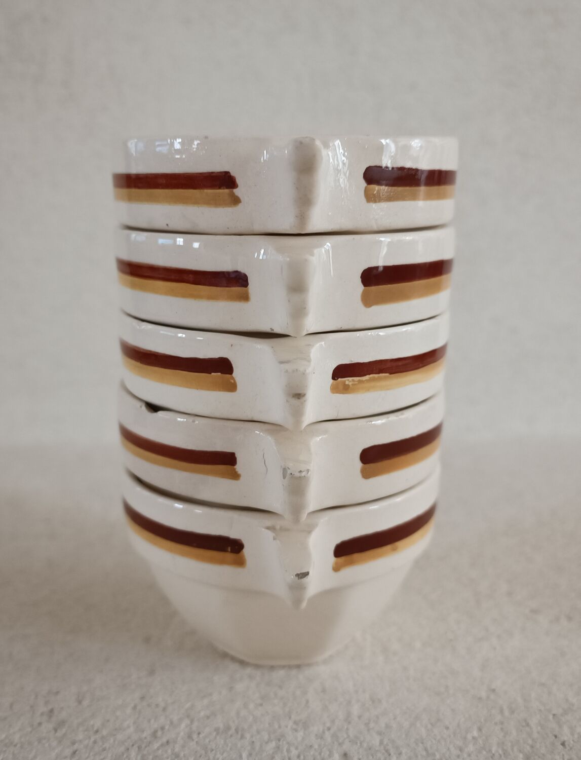 Set of five Digoin Sarreguemines cups