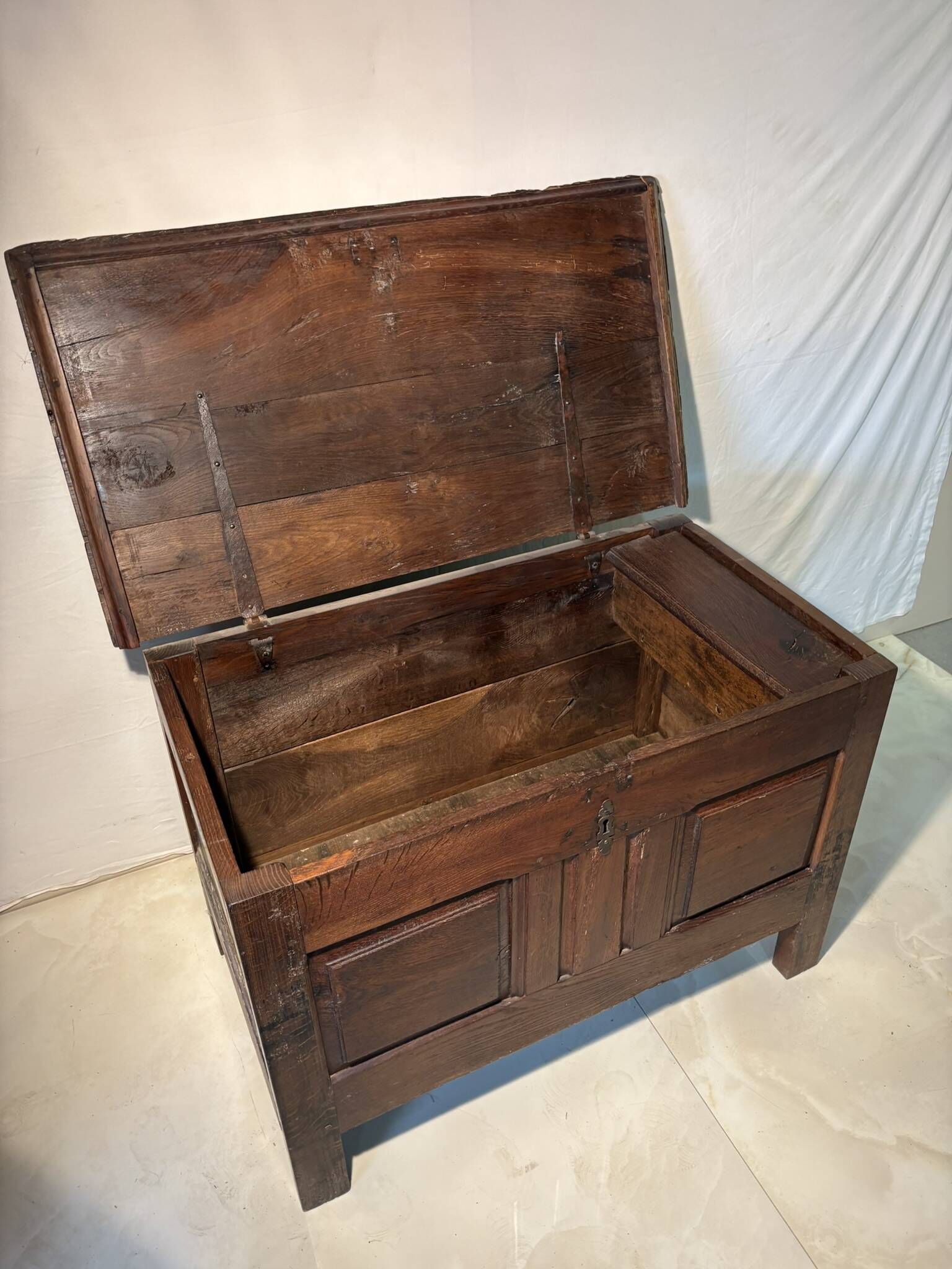 Rustic antique oak chest, original fittings and moulded panels.