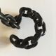 Candlestick with iron link chain and bronze cup