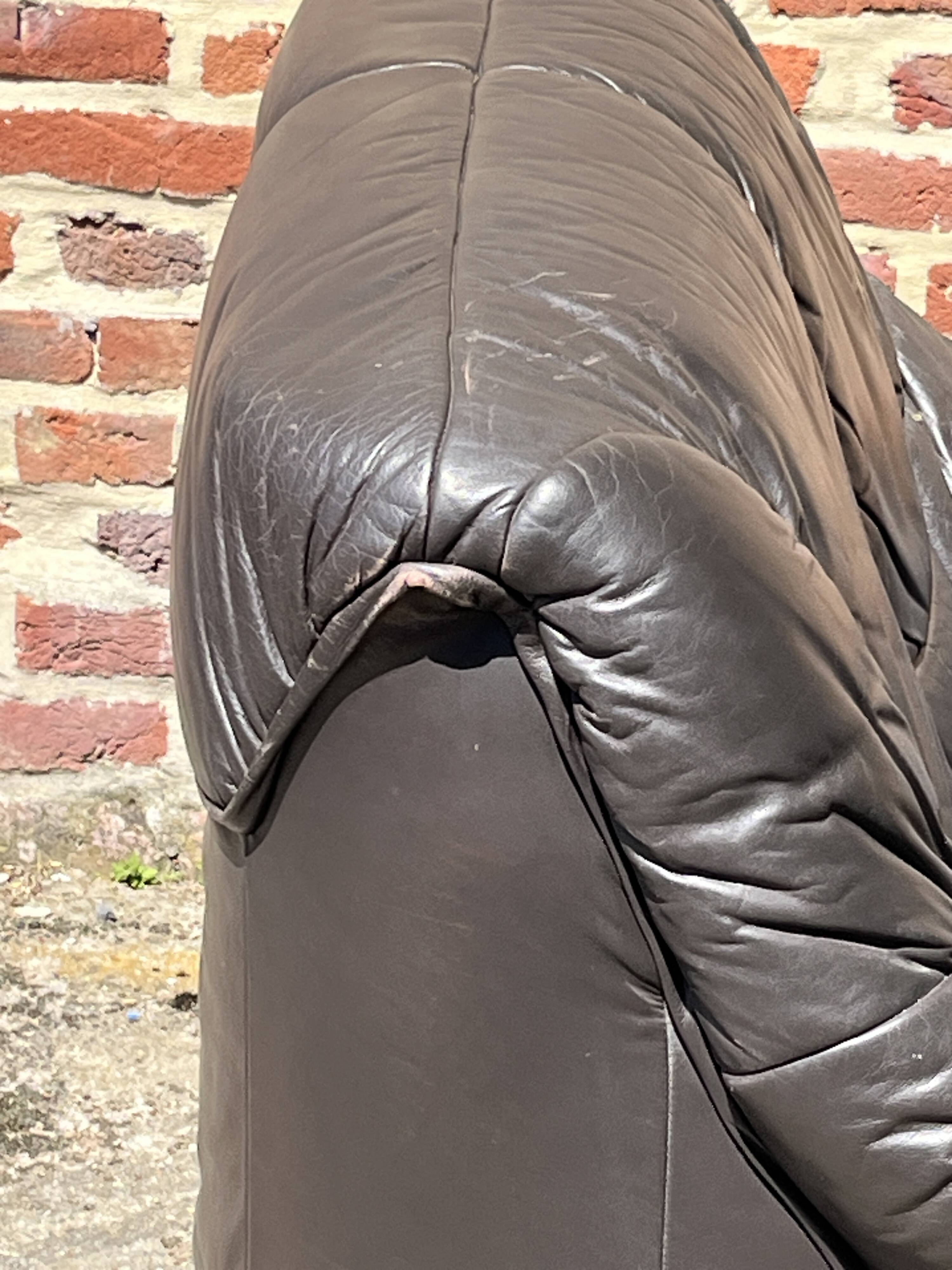 Pair of patinated leather club armchairs