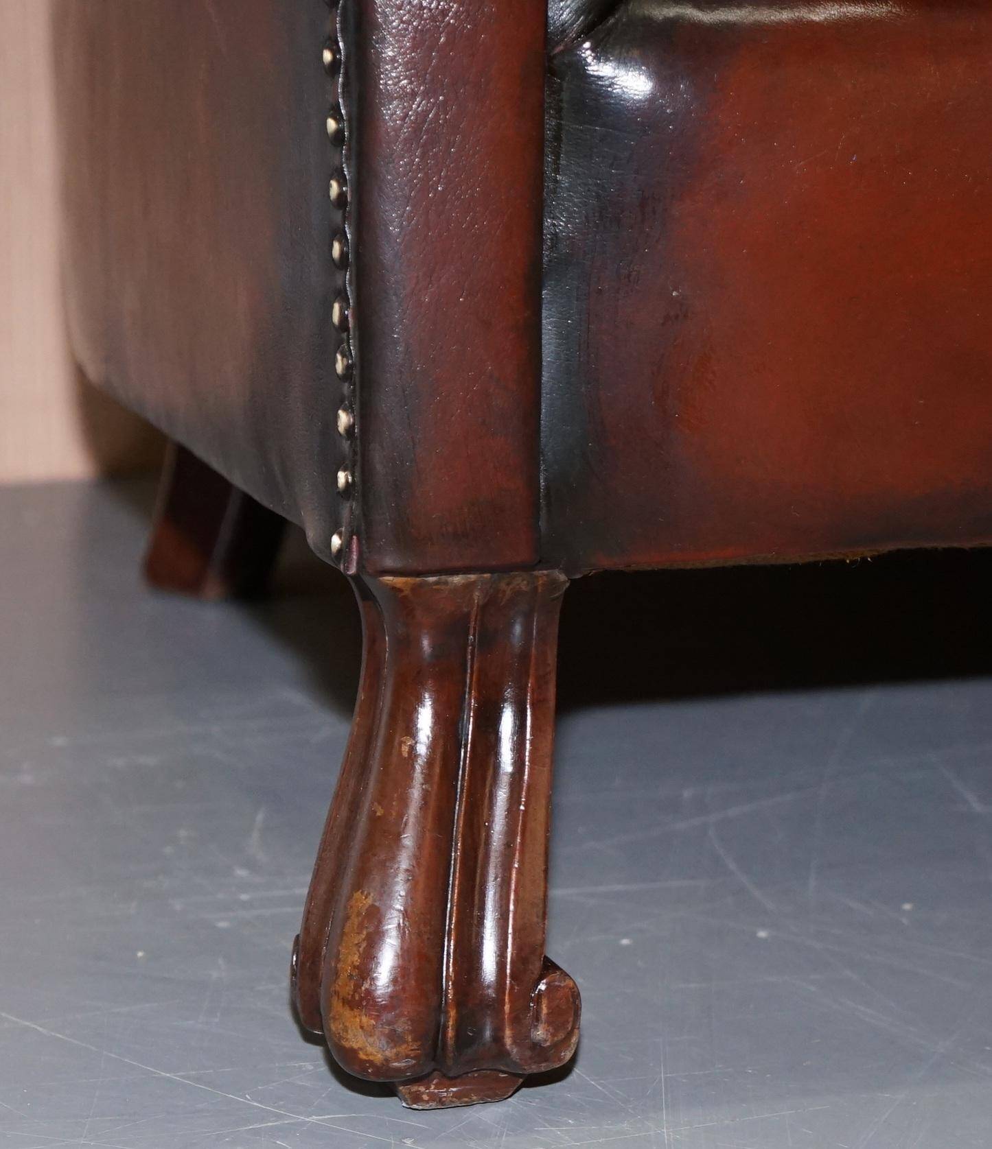 Victorian leather canapé and armchair, barrel back, circa 1860, restored.