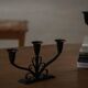 Early 20th century, pair of Danish Art Deco candlesticks in metal with three arms, 1930s.