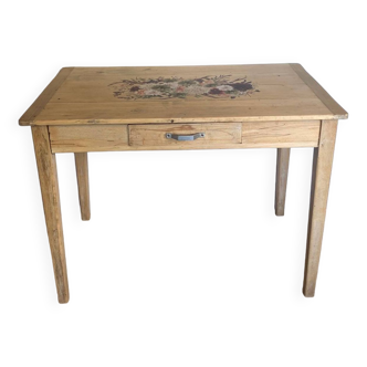 Raw wood table with floral pattern