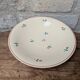 Round serving dish Moulin des Loups Orchies with small flower decoration 25.5cm