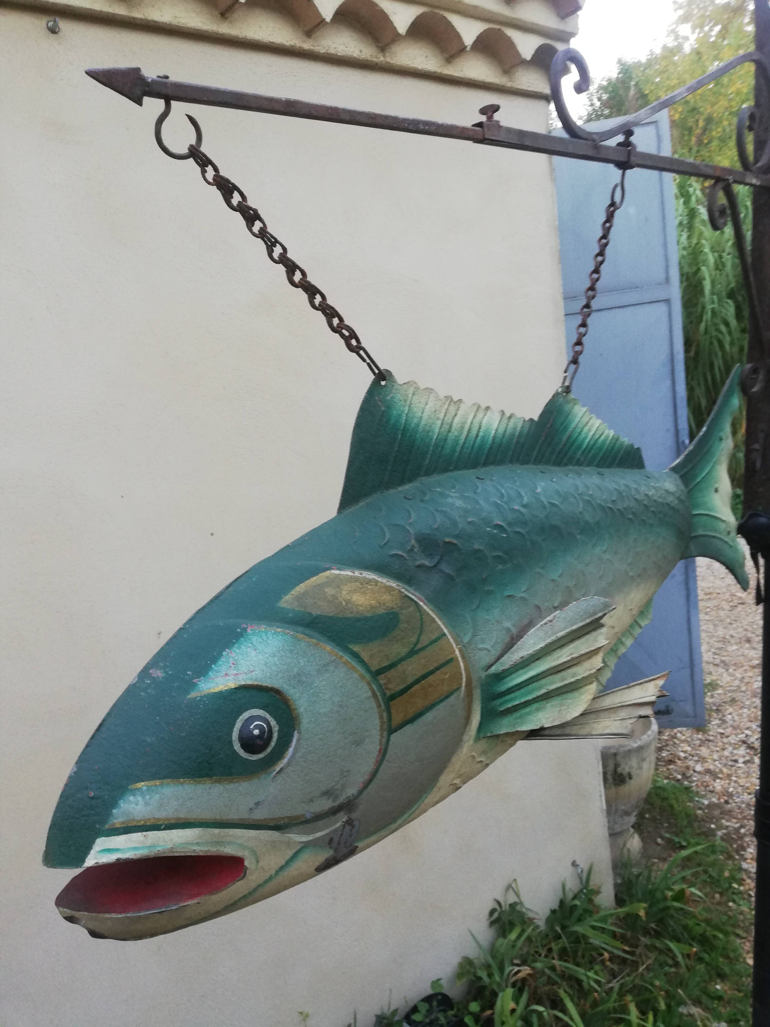 Panel depicting a fish in sheet metal