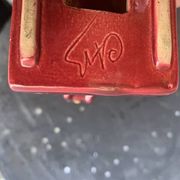 Dog sign CAB in vintage burgundy red enameled ceramic slip, art deco